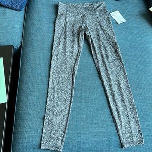Athleta salutation stash pocket leggings. Tags still on. Size ST.